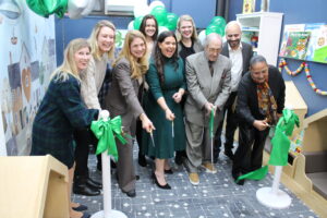 SCAN-Harbor and New York Junior League cut the Ribbon on a newly refurbished Nursery School Library.