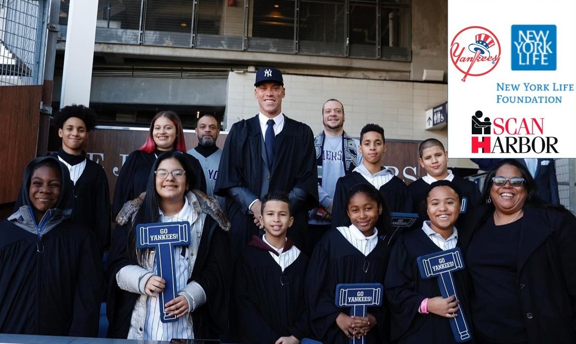 New York Yankees player, Aaron Judge pictured with SCAN-Harbor staff and youth program participants.